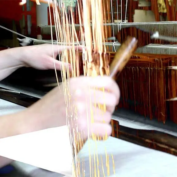 Promotional still for The Art and Science of Linen showing layered textile and botanical imagery.