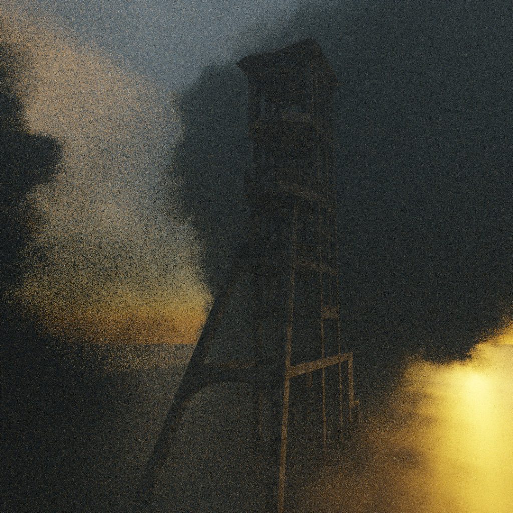 The form of a large industrial coal mining tower is just visible through a thick cloud of dark smoke